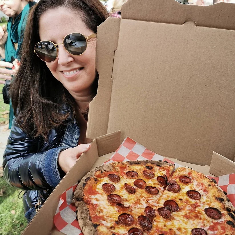 Young diverse couple having lunch with junk food